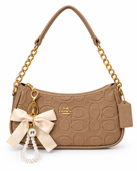 Coach Tery Trendy: Sand – bolso Infinita